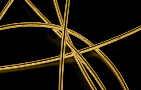 yellow cable on the black background. The inversionの写真素材