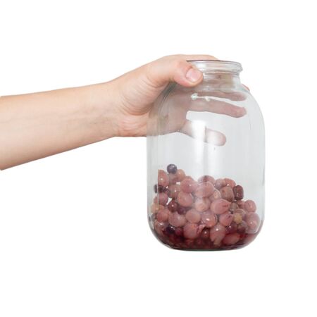 stewed in his hand on a white backgroundの写真素材