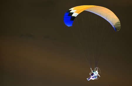 Parachute in the sky in the inversionの写真素材