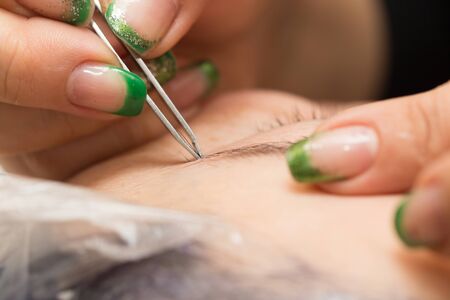 correction of eyebrows in a beauty salon