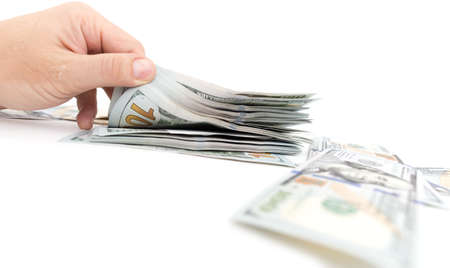 Dollars in hand on a white backgroundの写真素材