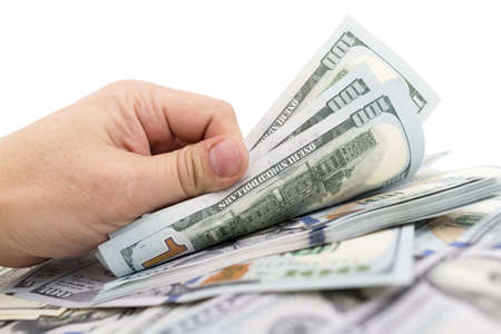 Dollars in hand on a white background