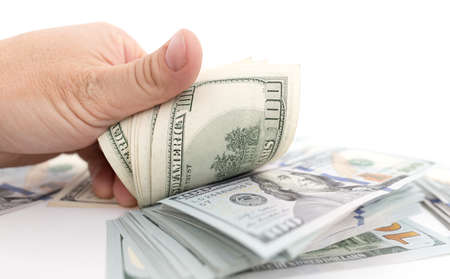 Dollars in hand on a white background