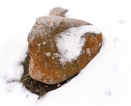 stones in the snow on the natureの写真素材