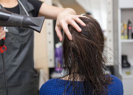 blow-drying in a beauty salonの写真素材