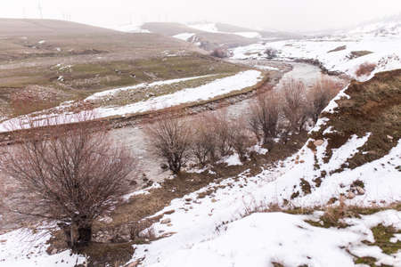 mountain river in the winter in natureの写真素材