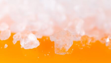 salt on an orange background. macroの写真素材