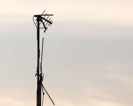 Antenna against the sky dawn sunの写真素材