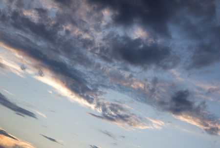 background of the sky with clouds at sunset