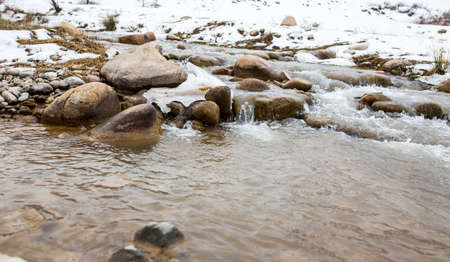 mountain river in the winter in natureの写真素材