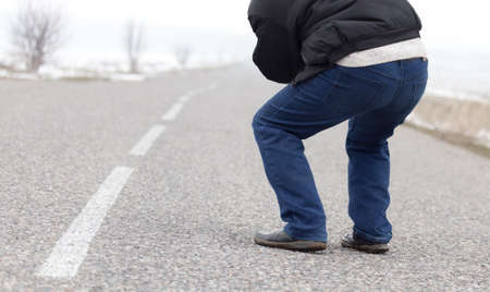 man standing on the roadの写真素材