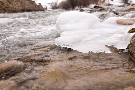 mountain river in the winter in natureの写真素材