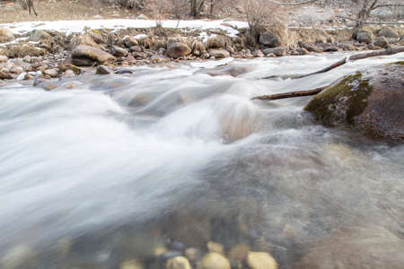 mountain river in the winter in natureの写真素材