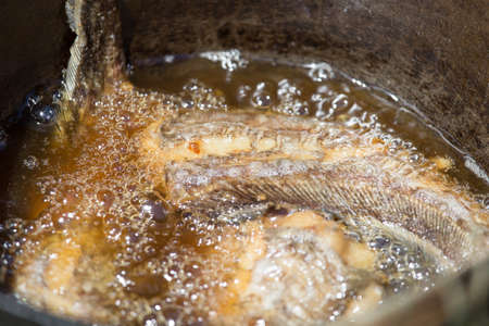 fish fried in oilの写真素材