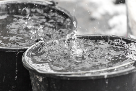 droplets in water in a bucketの写真素材