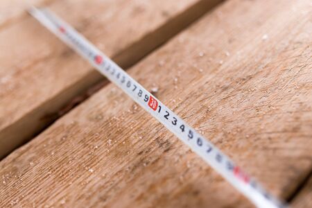measuring meter wooden beams as backgroundの写真素材