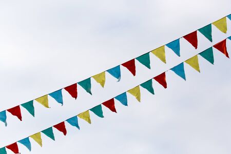 multicolored flags against the skyの写真素材
