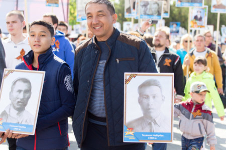 SHYMKENT city, KAZAKHSTAN MAY 9, 2015: Victory Day in memory of the soldiers of the Great Patriotic War. The photograph izobrazhon Immortal Regimentのeditorial素材