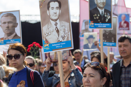 SHYMKENT city, KAZAKHSTAN MAY 9, 2015: Victory Day in memory of the soldiers of the Great Patriotic War. The photograph izobrazhon Immortal Regimentのeditorial素材