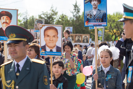 SHYMKENT city, KAZAKHSTAN MAY 9, 2015: Victory Day in memory of the soldiers of the Great Patriotic War. The photograph izobrazhon Immortal Regimentのeditorial素材