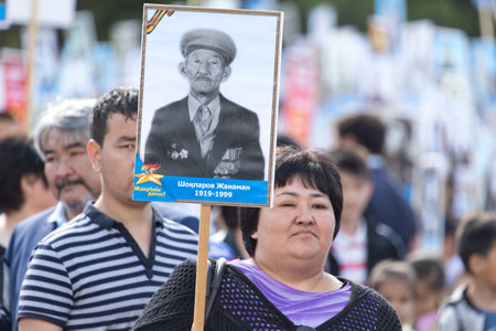 SHYMKENT city, KAZAKHSTAN MAY 9, 2015: Victory Day in memory of the soldiers of the Great Patriotic War. The photograph izobrazhon Immortal Regimentのeditorial素材