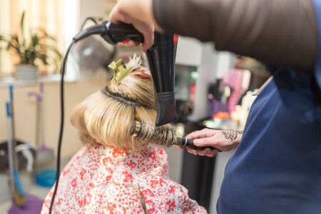 blow-drying in a beauty salonの写真素材