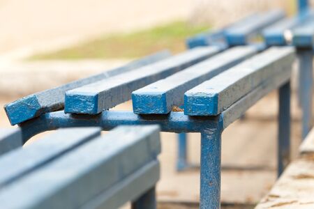 blue wooden bench in a park on the natureの写真素材