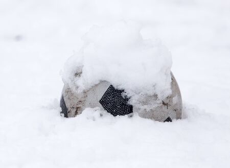 soccer ball in the snow in the winterの写真素材