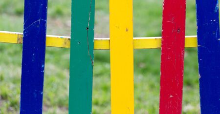 multicolored wooden fence as a backdropの写真素材