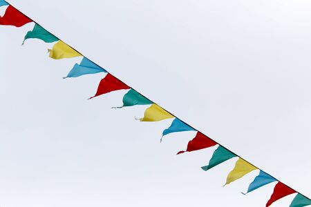 multicolored flags against the skyの写真素材