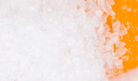 salt on an orange background. macroの写真素材