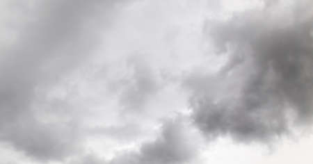 thick black clouds as backgroundの写真素材