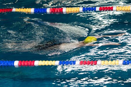 boy swimming in the poolの写真素材