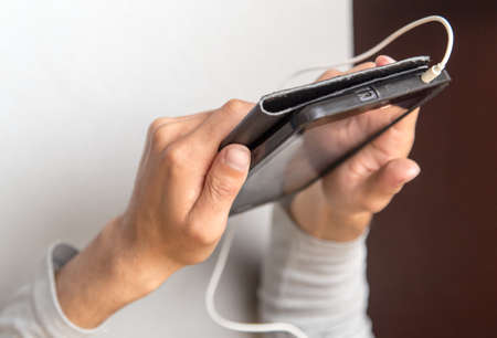 black tablet in man's handsの写真素材