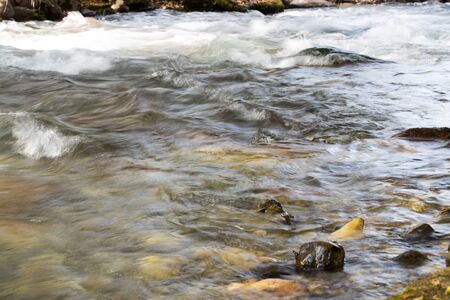rough water in the mountain river water as a backgroundの写真素材