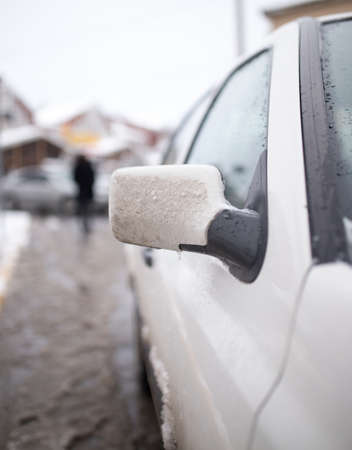 snow on the car in the winter on the natureの写真素材