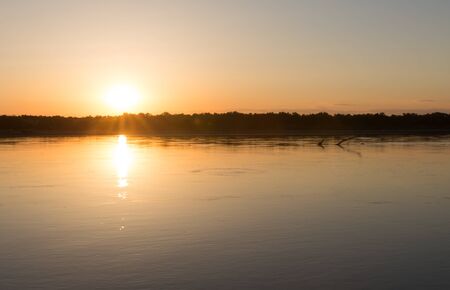 a beautiful sunset on the river