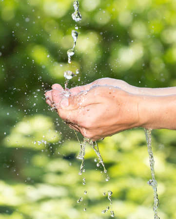 hand in the water in nature