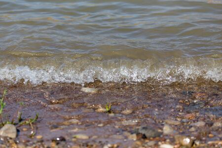 wave on the shore as the backgroundの写真素材