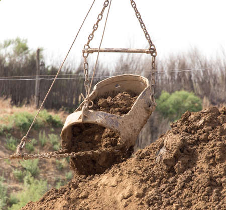 excavator digging a big bucket