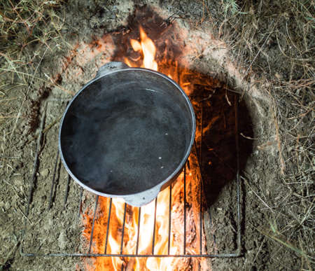 cauldron on fire at nightの写真素材