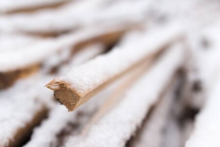 firewood in the snow in the winterの写真素材