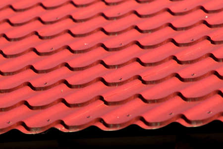 red roof tiles on the roof as a background