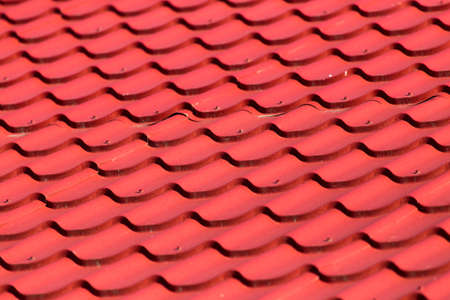 red roof tiles on the roof as a background