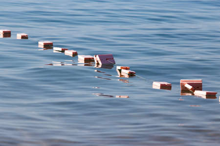 Fishing floats on the surface of the waterの写真素材