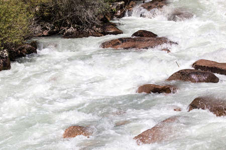 rough water in a mountain riverの写真素材