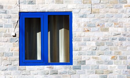 window in a brick building of graniteの写真素材
