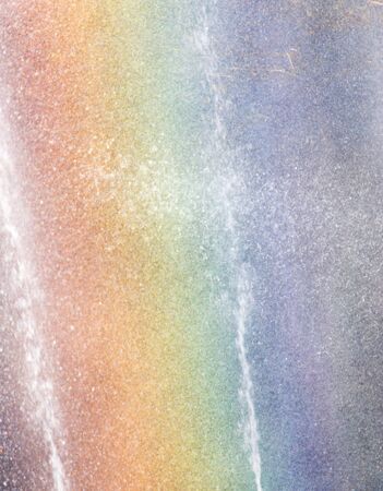 Rainbow in the fountain as a backdropの写真素材