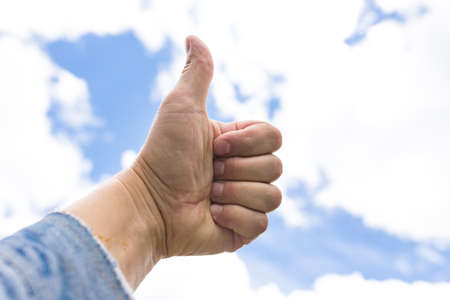 hand raised to the skyの写真素材