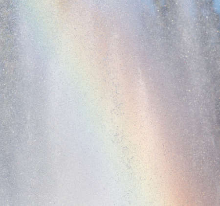 Rainbow in the fountain as a backdropの写真素材